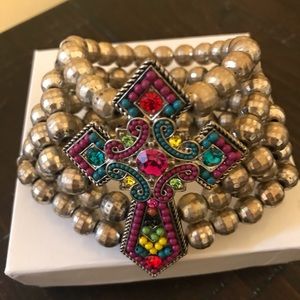 Wide bracelet with jeweled cross